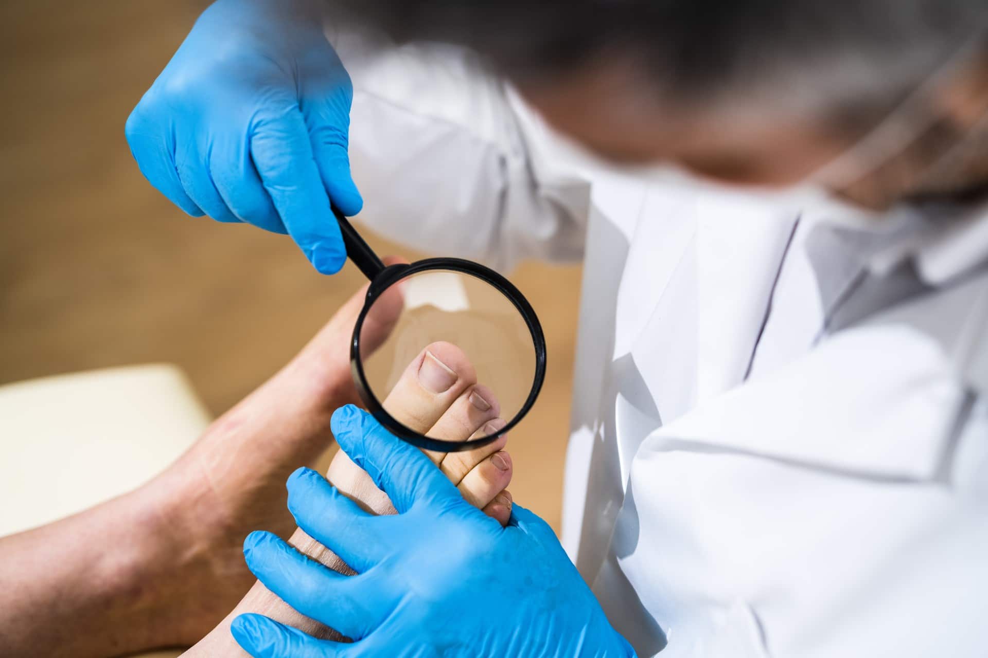 a doctor inspecting an ingrown toenail